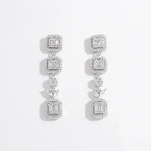 Sterling silver geometric dangle earrings with zircon clusters