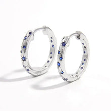 Sterling silver huggie earrings with blue star and round zircon gems