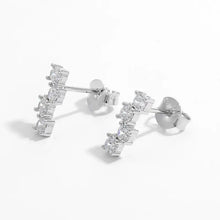 Pair of 925 sterling silver stud earrings with curved bar and five clear zircon stones