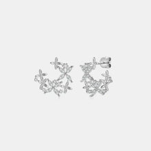 Sterling silver moissanite lucky clover stud earrings with floral CZ motif