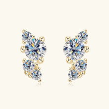 Sterling silver moissanite stud earrings with gold-toned clear gemstone clusters