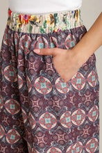 Umgee full size mixed print wide-leg pants with muted purple and red geometric floral pattern and colorful elastic waistband