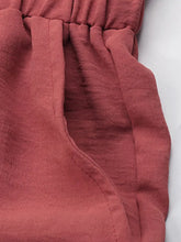 Soft rust-colored cotton perfee frill tied wide leg pants with relaxed gathered waistband and visible stitching