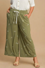 Umgee olive green wide leg pants with white embroidered bows and lace drawstring waistband plus size design