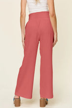 Coral-colored double take full size texture smocked waist wide leg pants with soft flowing fabric and high-waisted fit