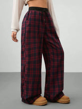 Red and black plaid wide leg pants with elastic drawstring waist perfect for casual and comfortable wear