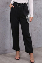 Black high-waisted belted paperbag waist pants with ruffled waistband and silver-toned belt buckle