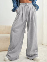 Gray heathered wide leg pants with elastic drawstring waist made of soft fabric for comfortable wear