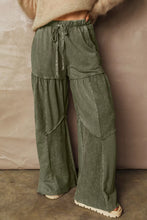 Olive green corduroy tiered wide leg pants with drawstring waist and patchwork design for stylish comfort