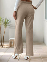 Beige ribbed corduroy high-waisted slit pants with wide legs and an elastic waistband for a comfortable fit