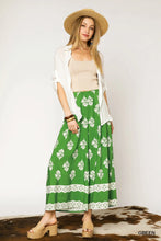 Umgee floral pleated wide-leg pants in green with white floral embroidery, lace trim, elastic waistband, machine wash, tumble dry