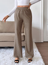 Brown and beige plaid high-waisted wide leg pants made from soft woven fabric with easy care instructions