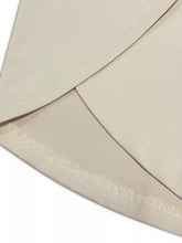 Beige fabric with neat matching stitching on plus size relaxed fit casual pants for comfortable wear