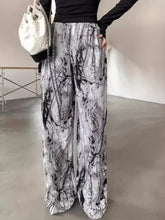 Black and white marble patterned abstract print wide leg pants made from soft fabric for stylish comfort