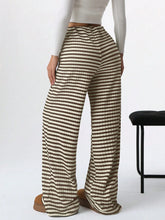 Striped wide leg drawstring pants in beige and dark brown with a relaxed fit and lightweight textured fabric