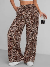 Leopard print wide leg pants in soft flowing fabric with drawstring waist for comfortable stylish wear