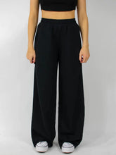 Black wide leg pants with elastic waist wide design and a relaxed flowing silhouette for comfortable wear