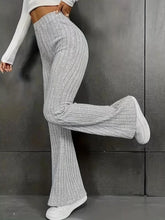 Plus size gray ribbed knit high waist flare pants made from soft stretch fabric for comfortable stylish wear