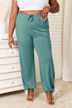 Teal loose-fitting basic bae full size soft rayon drawstring waist pants with pockets and ankle cuffs