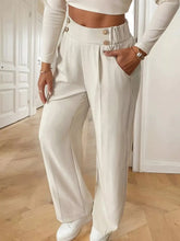 Cream-colored full size high-waisted wide-leg pants with buttoned front and side pockets machine wash cold