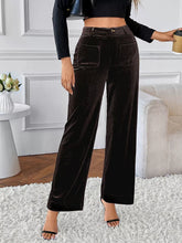 Black corduroy high-waisted wide-leg pants featuring a high waist and front pockets for stylish comfort