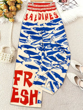 Plus size printed wide leg cream pants with bold blue fish print red saedines fresh lettering and elastic waistband