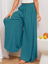 Teal wide leg pants with elastic waistband drawstring and pockets designed for comfort and casual wear