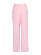 Soft pink tied wide leg pants with elastic waistband featuring a comfortable wide leg design