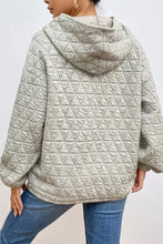Light gray quilted long sleeve hoodie with oversized fit and hood