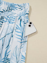 Blue and white tropical print shirred waistband wide leg pants with high-waisted elastic waistband design