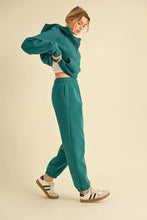 Teal cropped hoodie and drawstring elastic waist joggers set from aemi+co made of soft fabric for casual wear