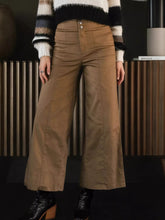 High-waisted wide leg cropped pants in tan polyester fabric with button closure and subtle front pleats