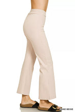 Sand beige heavy ponte pintuck pants with a smooth tailored fabric and elastic waistband high-waisted flared style