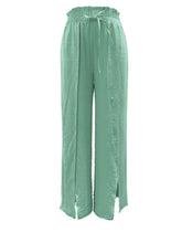 Light green slit wide leg pants with gathered waistband and matching drawstring for a comfortable fit