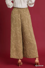 Tan umgee jacquard wide-leg pants featuring a subtle embroidered leaf pattern for elegant casual wear