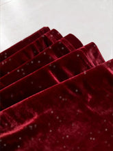 Deep red velvet high waist flared pants with subtle glittery texture showcasing elegant flared pants design