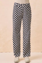 BiBi Gameday checkered printed pants feature black and white wide-leg checkered pants for a bold style statement