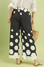 Black umgee wide leg pants with bold white hexagon print and scalloped hem perfect for stylish casual wear