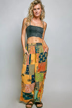 Pol printed patchwork wide leg pants featuring vibrant multicolored floral and geometric printed patchwork patterns with adjustable side drawstring