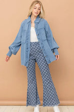 Light blue corduroy jacket with ruffled trim and buttons paired with checkerboard high waist bell pants