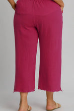 Magenta Umgee plus size wide-leg pants with raw hem frayed edges and elastic waist for a relaxed fit