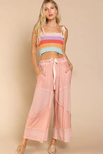 Pastel pink pol elastic waistband wide leg pants with drawstring and layered semi sheer fabric panels