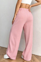 Pink and white striped ribbed knit drawstring wide leg pants with ribbed texture for comfortable casual wear