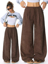 Brown corduroy wide leg pants with elastic waistband and drawstring offering comfortable casual leg pants option