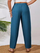 Plus size casual pants in teal with a relaxed fit elastic waistband and subtle textured fabric blend