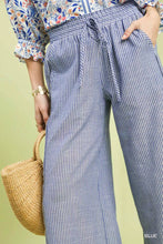 Umgee linen blend striped wide leg pants in blue and white with a drawstring waistband for comfortable wear
