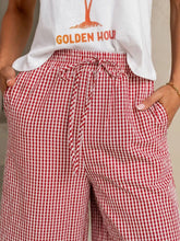 Red and white gingham print wide leg casual pants with a drawstring waist for comfortable everyday wear