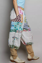 Pol printed patchwork wide leg pants in vibrant floral striped and solid fabric with elastic cuffs and adjustable drawstring