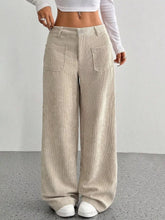 Beige wide leg corduroy pants with ribbed texture and front pockets offering a stylish corduroy pants option