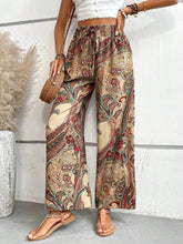 Beige red and green paisley patterned wide leg pants with elastic waistband perfect for casual wear
